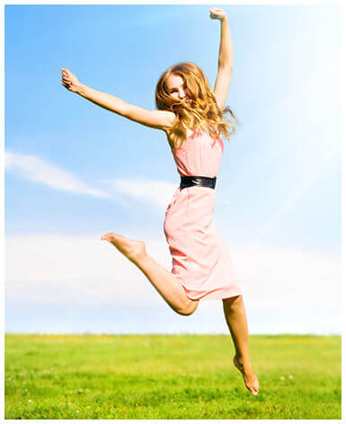Woman happily jumping